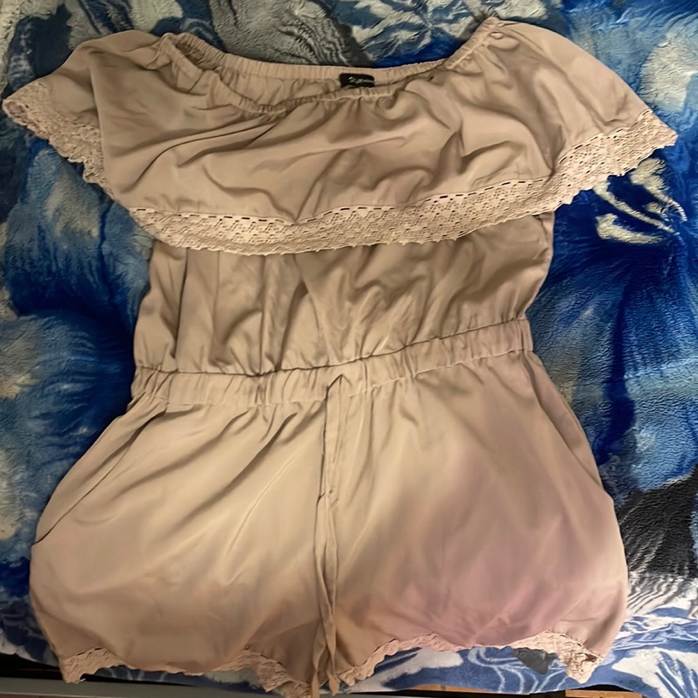 off the shoulder pinkish-cream colored romper with pockets.